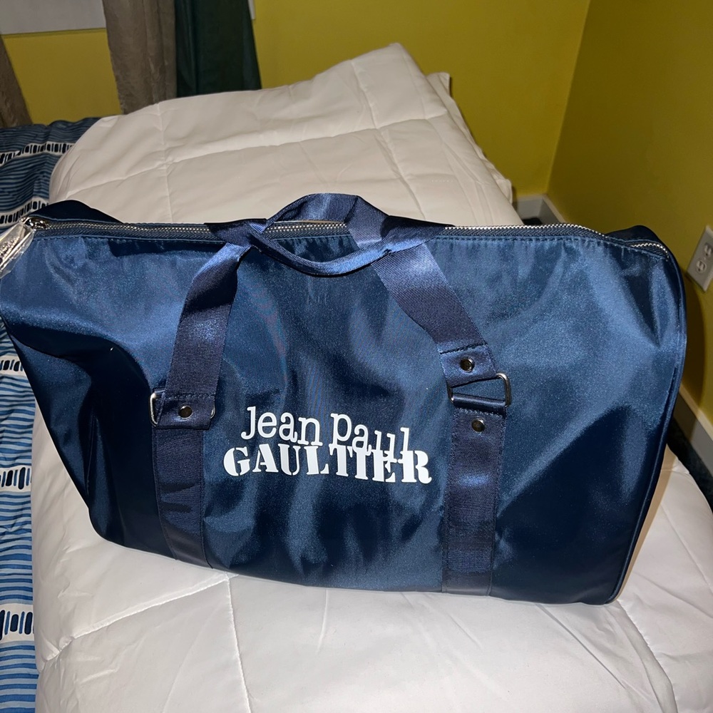 NWOT Jean Paul Gaultier overnight bag, blue,   2 handles, zipper, inside pocket
